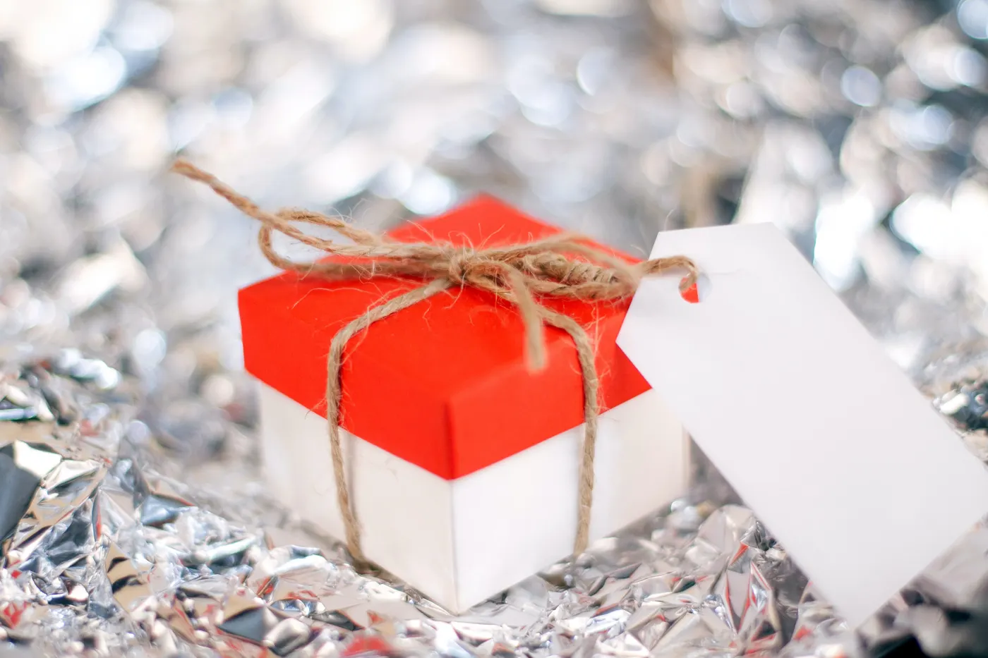 Gift box tied with twine and a blank tag