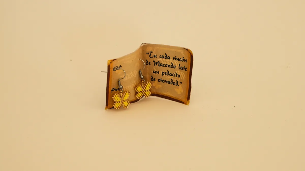 Butterfly earrings in a small Macondo book