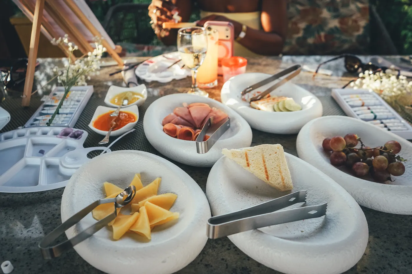 Cheese, cured meats and fruit served on the brunch table