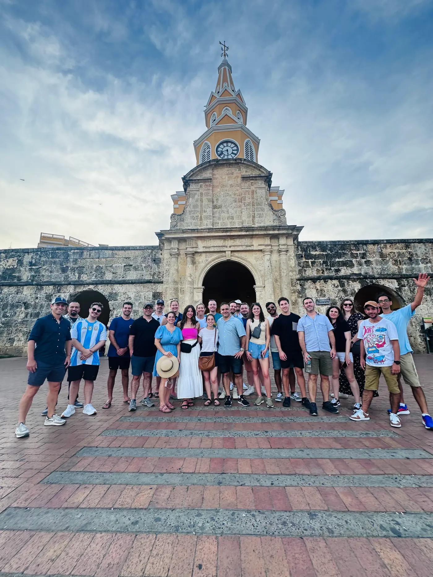 Group of visitors in front of the Clock Tower gate of the walled city of Cartagena