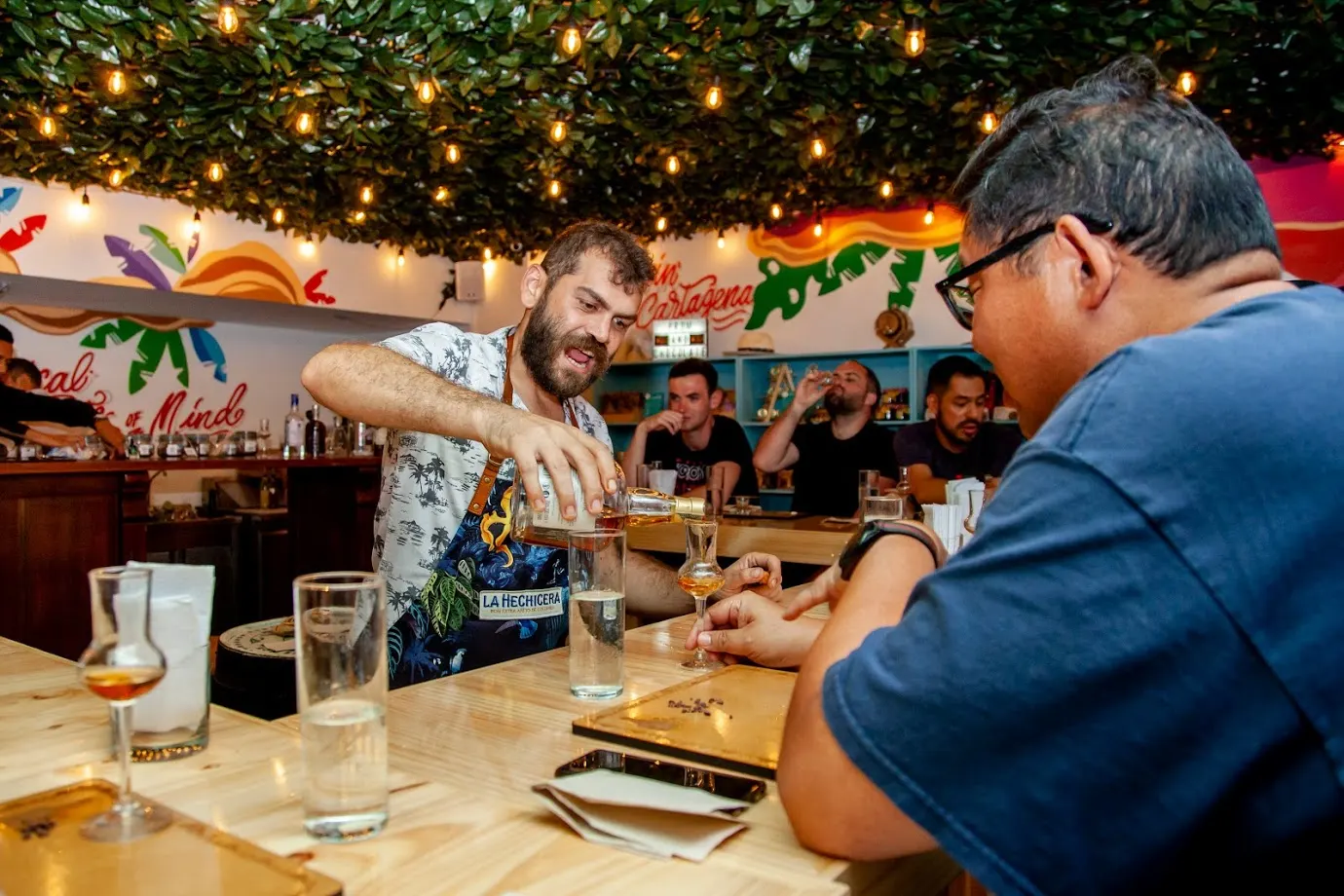 Guests at a bar during a rum tasting